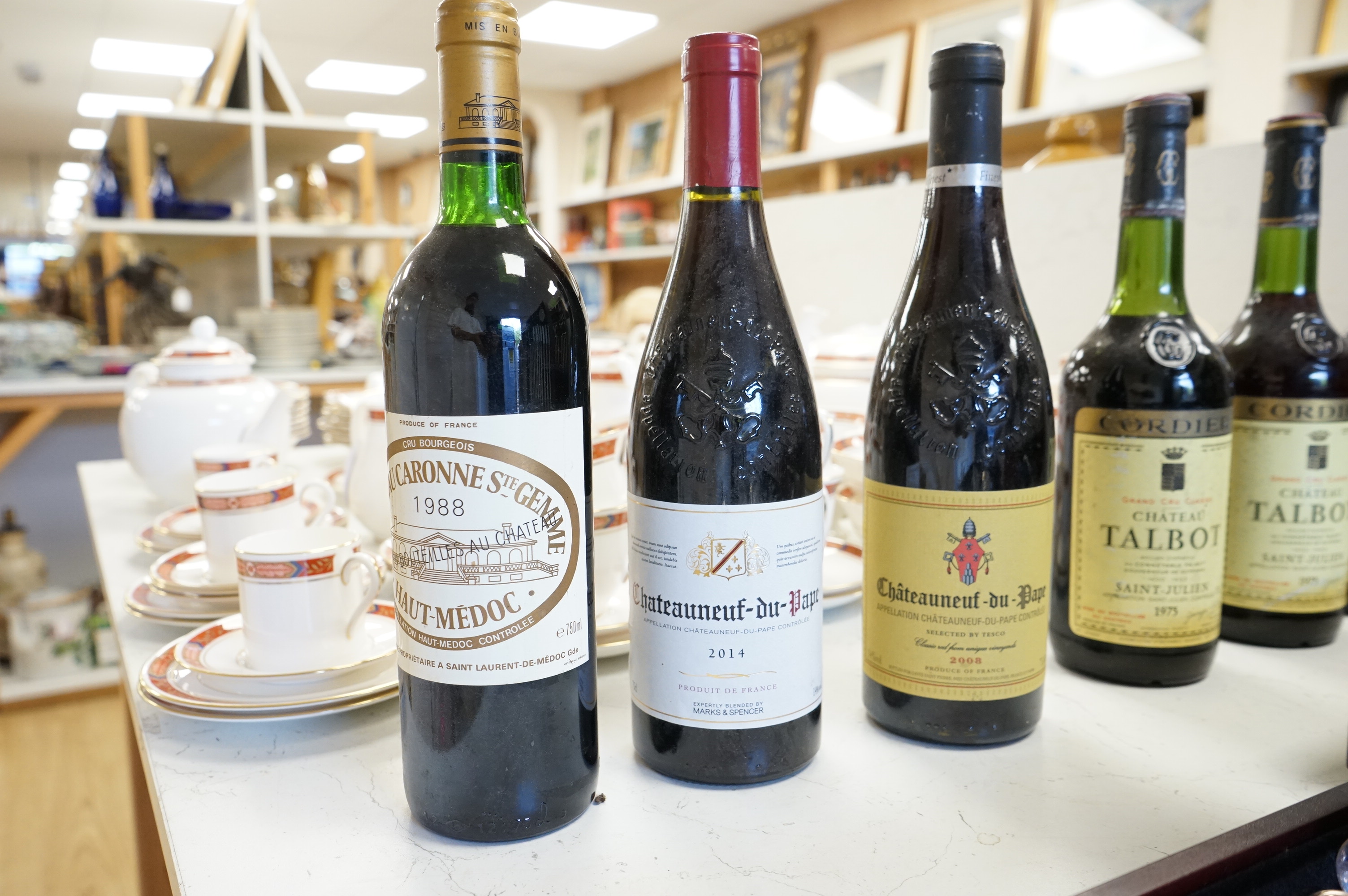 Eight bottles of red wine including three bottles of Chateau Talbot Saint Julien 1975, Chateauneuf du Pape 2008, Chateau Caronne Ste Gemme 1988 etc.